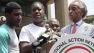 Sybrina Fulton, mother of Trayvon Martin, is joined by her son Jahvaris Fulton, second from left, the Rev. Al Sharpton, left, and her attorney Benjamin Crump as she speaks to the crowd during a rally in New York