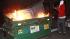 Oakland hopes to avoid Mehserle riot repeat :: A protestor burns garbage cans during a demonstration in Oakland, Calif., after a guilty verdict for Johannes Mehserle, Thursday, July 8, 2010.