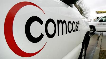 A technician for Comcast heads out on a job Feb. 2, 2006 in a Salt Lake City file photo.
