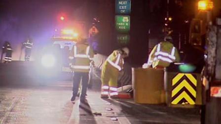 Caltrans crews cleaning up sand barrels