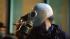 City cleans up following 'Occupy' strike :: Occupy Oakland demonstrator wearing gas mask