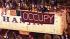 Protesters descend on Port of Oakland :: Occupy sign on semi truck