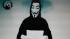 This image taken from a video posted by Internet hackers on the Greek Justice Ministry web site on Friday, Feb. 3, 2012, shows a figure in a Guy Fawkes mask reading a statement.