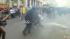 Oakland police officers and protesters clash...