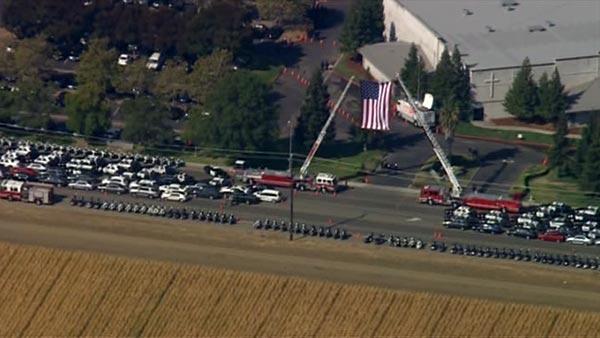 Flag flying over CHP Officer Kenyon Youngstrom's funeral