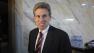 U.S. envoy Chris Stevens takes a coffee before attending meetings at the Tibesty Hotel