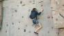 amputee climbs rock wall at clinic