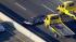 Big-rig carrier drops cars, forcing road...