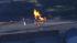 An underground fire caused by a gas pipeline rupture burned for hours and caused the evacuation of nearby homes. An underground fire caused by a gas pipeline rupture burned for hours and caused the evacuation of nearby homes.