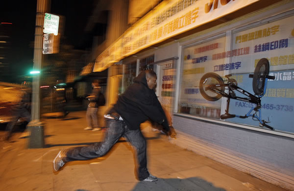 A demonstrator lies on the ground during a...