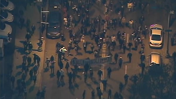 Demonstrators march during street protests in...