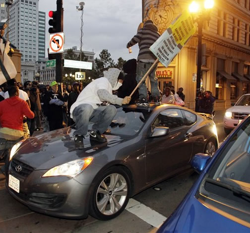 Demonstrators march during street protests in...