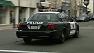 A police car drives through downtown Vallejo.