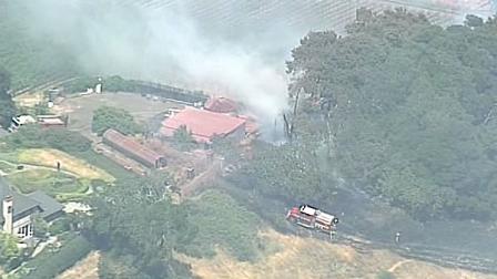Firefighters contain fire that threatened 30 homes