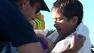 Kid rescued from overturned boat