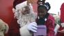 Santa flies in by seaplane to deliver toys to children in Marin City