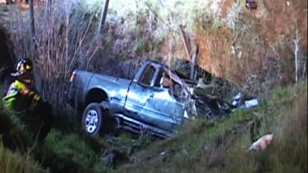 Pickup truck in a ditch after traffic accident.