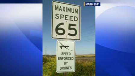 fake road sign saying speed enforced by drones
