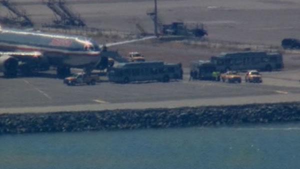 Two people were detained after a security threat prevented a plane from taking off from SFO Thursday.