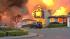 One year later: Are our pipelines really safer? :: A home on fire after a PG&E gas pipeline exploded in a San Bruno neighborhood in September 2009.