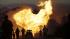A massive fire is roars through a mostly...