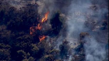 Crews are battling a brush fire in Portola Valley near Woodside.