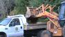 Crane shovels mud in Daly City