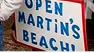 Homemade sign reads Open Martins Beach