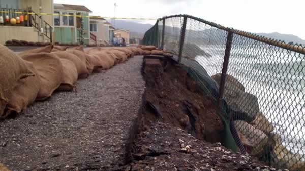 A few mobile homes in Pacifica were quickly boarded up after big waves began pounding the beach below.