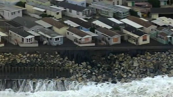 A few mobile homes in Pacifica were quickly boarded up after big waves began pounding the beach below.