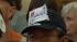 note pinned to a hat saying save the music