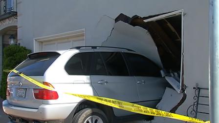 A woman and her baby escaped injury Tuesday when she crashed her SUV into a house in San Francisco.