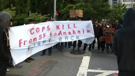 Dozens marched through the Financial District to show their solidarity with people protesting against police in Southern California.