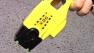 Person holding a Taser