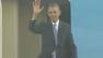 President Obama waves as he walks off the plane at SFO