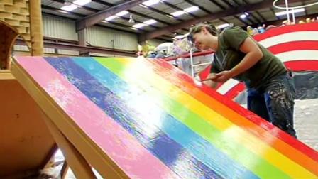 Volunteer painting a sign for SFs Pride Parade
