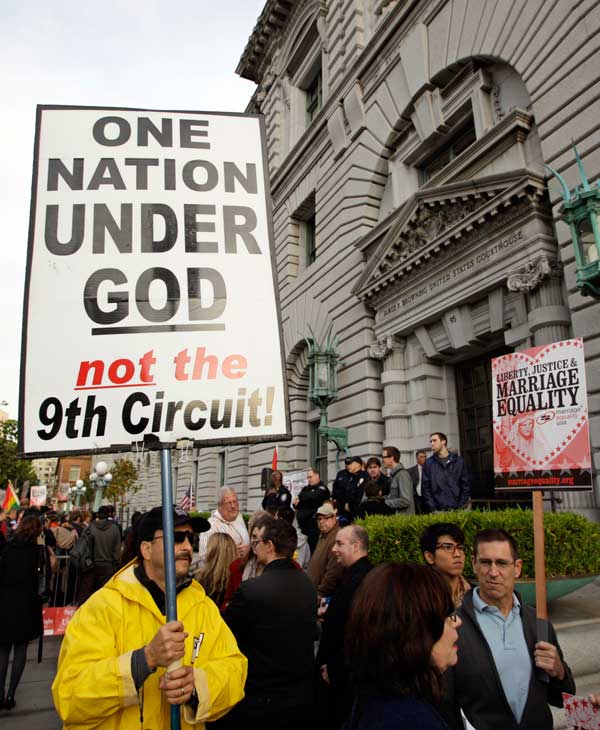 Steve Harris carries a sign against gay marriage...