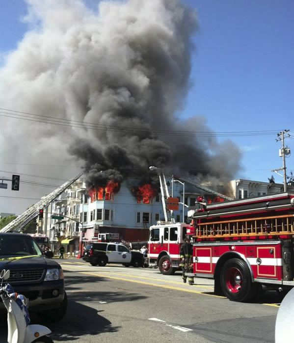 San Francisco firefighters battle a four-alarm...