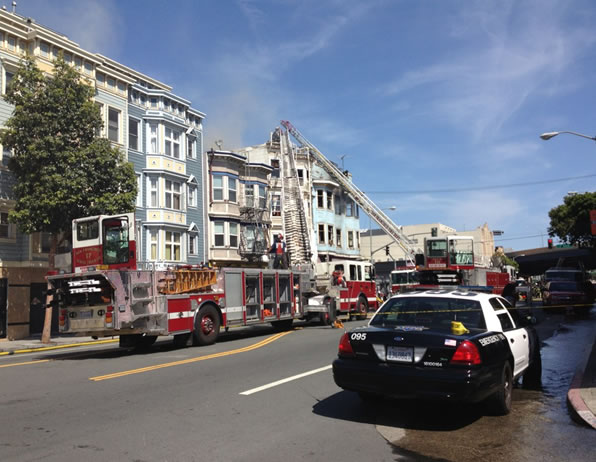 San Francisco firefighters battle a four-alarm...
