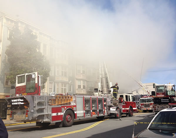 San Francisco firefighters battle a four-alarm...