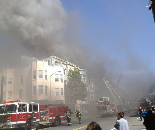 San Francisco firefighters battle a four-alarm...