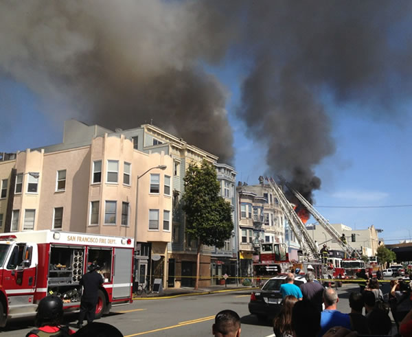 San Francisco firefighters battle a four-alarm...