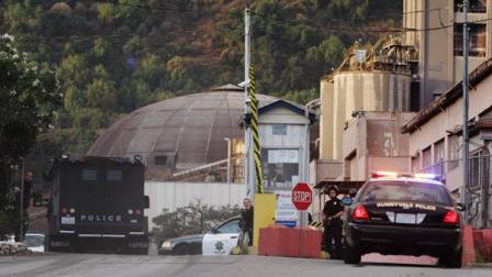 Police surround the entrance of the Lehigh Southwest Cement Company in Cupertino, Calif., Wednesday, Oct. 5, 2011.