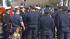 Officers gather outside HP Pavilion before the...