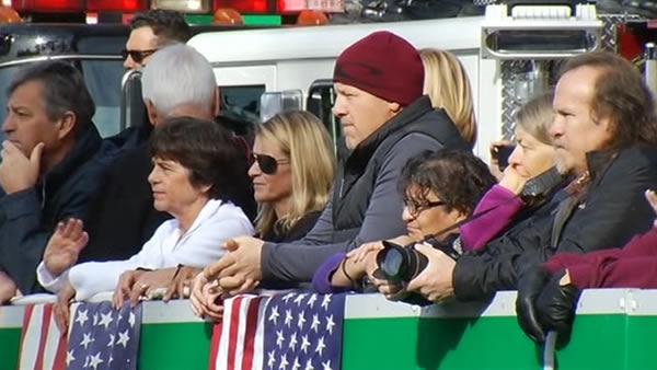 People watching procession for two fallen Santa Cruz officers