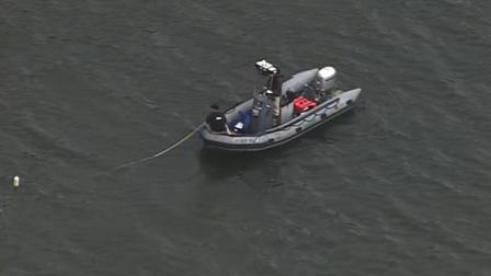 Rescuers search for a missing person on Lexington Reservoir near Los Gatos.