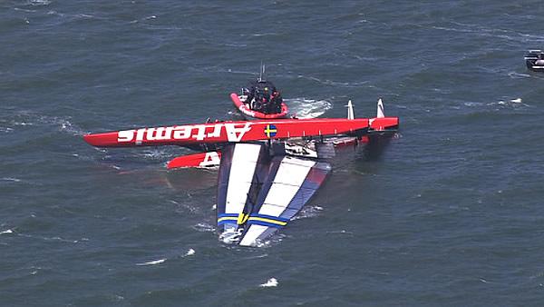 America's Cup racing boat capsized on the Bay