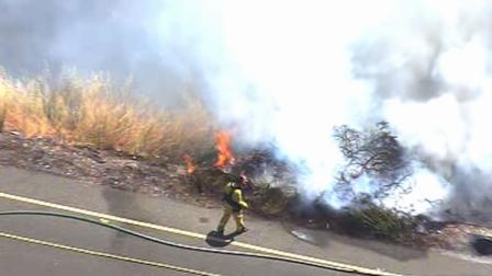 A brush fire has prompted the CHP to close state Highway 237 in both directions between North First
Street and Zanker Road.