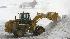 A plow removes snow from the tarmac at Reagan...