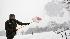Park Ranger Anthony Angelone shovels snow at the...